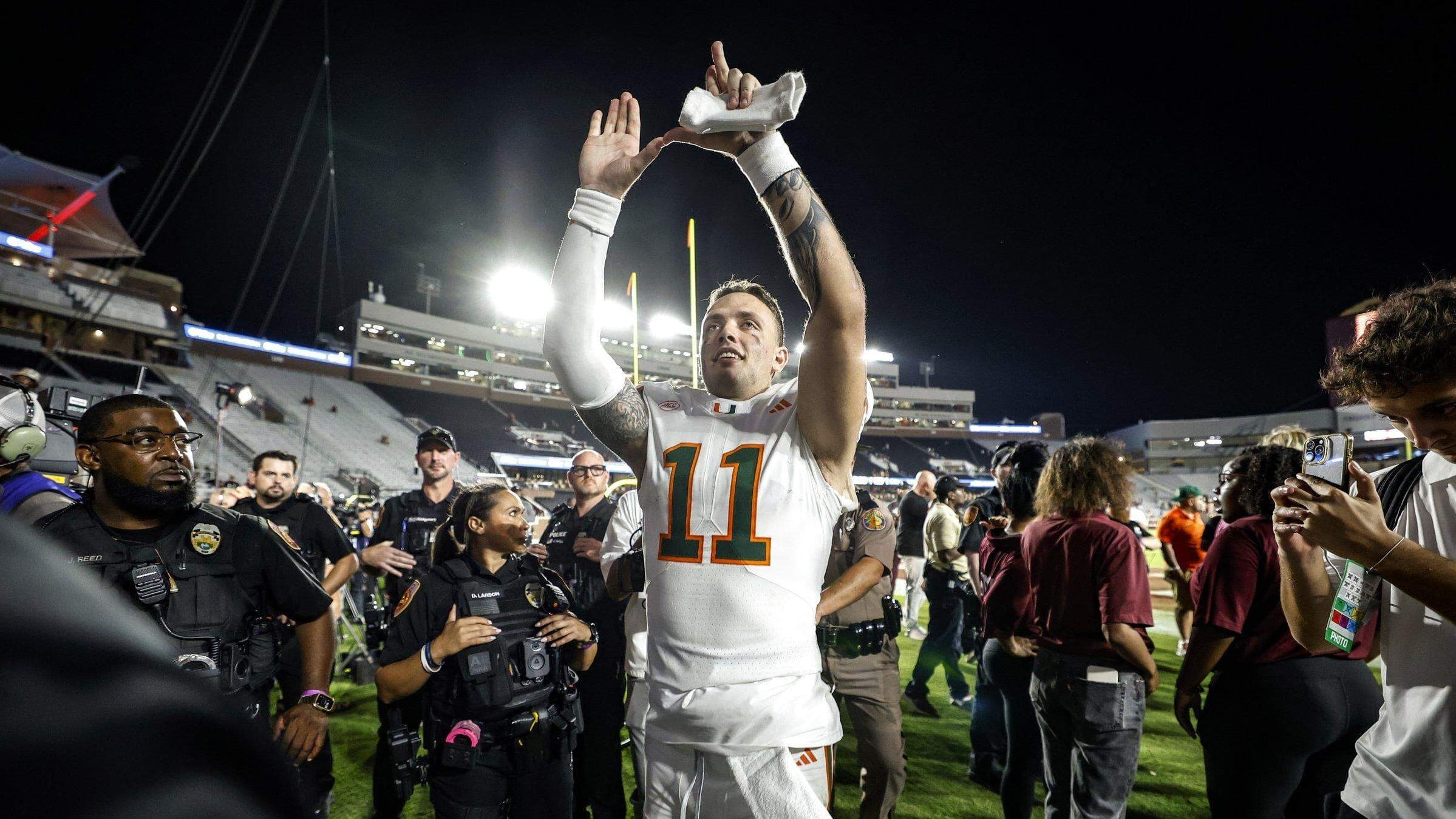 Miami Hurricanes quarterback Carson Beck (11) flashes the U after the Hurricanes defeat the Florida State Seminoles during their NCAA game at Doak Campbell Stadium in Tallahassee, Florida, on Saturday, October 4, 2025. PHOTO BY AL DIAZ adiaz@miamiherald.com  Read more at: https://www.miamiherald.com/sports/college/acc/university-of-miami/article313724569.html#storylink=cpy